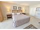 Cozy bedroom showcasing a large bed with bedside tables and lamps at 9820 Queensway Blvd. # 1603, Myrtle Beach, SC 29572