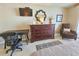 Functional bedroom setup with a desk, dresser, and accent chair at 9820 Queensway Blvd. # 1603, Myrtle Beach, SC 29572