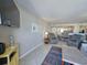 Bright and open living area, featuring stylish furnishings and an open layout into the kitchen with stainless steel appliances at 9820 Queensway Blvd. # 1603, Myrtle Beach, SC 29572