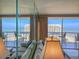 Bright living room with comfortable seating and sliding doors to a balcony with panoramic ocean views at 9820 Queensway Blvd. # 1603, Myrtle Beach, SC 29572
