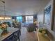 Relax in this cozy living room that offers plenty of space for seating and a dining area at 9820 Queensway Blvd. # 1603, Myrtle Beach, SC 29572