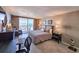 Spacious main bedroom with balcony access, offering partial views of the beach at 9820 Queensway Blvd. # 1603, Myrtle Beach, SC 29572