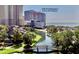 Beautiful aerial view of a condo building complex overlooking a bridge and a pristine beach at 9840 Queensway Blvd. # 1505, Myrtle Beach, SC 29572