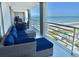 Relax on this balcony with comfy seating and ocean views at 9840 Queensway Blvd. # 1505, Myrtle Beach, SC 29572