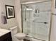 Clean bathroom with walk-in shower, modern fixtures, and white marble-style tile at 9840 Queensway Blvd. # 1505, Myrtle Beach, SC 29572