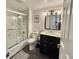 Clean bathroom with shower and bathtub, dark vanity, and a large mirror at 9840 Queensway Blvd. # 1505, Myrtle Beach, SC 29572