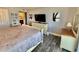 Comfortable main bedroom with a dresser and paintings on the wall at 9840 Queensway Blvd. # 1505, Myrtle Beach, SC 29572