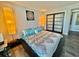 Inviting bedroom with unique lighting fixtures, closet, and colorful bedding at 9840 Queensway Blvd. # 1505, Myrtle Beach, SC 29572