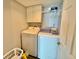 Bright laundry room featuring a washer, dryer, and storage cabinets at 9840 Queensway Blvd. # 1505, Myrtle Beach, SC 29572