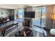 Inviting living room with large sliding doors that lead to a scenic balcony view at 9840 Queensway Blvd. # 1505, Myrtle Beach, SC 29572