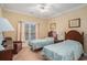 Bedroom with two twin beds, a window, and coastal-themed decor at 1000 Ray Costin Way # 107, Garden City Beach, SC 29576