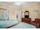 Bedroom featuring two twin beds, dresser and access to a closet with sliding doors at 1000 Ray Costin Way # 107, Garden City Beach, SC 29576
