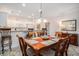 Charming dining room featuring classic wood furniture and a lovely light fixture with a view to the kitchen at 1000 Ray Costin Way # 107, Garden City Beach, SC 29576