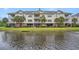 Scenic view of condos overlooking pond and landscaped grounds, creating a tranquil atmosphere at 1000 Ray Costin Way # 107, Garden City Beach, SC 29576