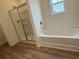 Bathroom featuring tile flooring, tub, and glass door shower at 1029 Jase Dr., Longs, SC 29568