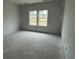 Bedroom featuring expansive windows for natural light and ample space, a comfortable retreat within the home at 1029 Jase Dr., Longs, SC 29568
