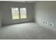 Bright bedroom featuring large windows for natural light, a comfortable and inviting space for relaxation and rest at 1029 Jase Dr., Longs, SC 29568
