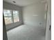 Spacious bedroom with natural light streaming through large windows at 1029 Jase Dr., Longs, SC 29568