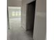 A hallway leading to a spacious living room under construction, bathed in natural light at 1029 Jase Dr., Longs, SC 29568