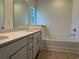 Bright bathroom featuring double sinks, vanity, and tub at 1033 Jase Dr., Longs, SC 29568