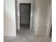 Unfinished hallway featuring neutral walls and doorways, awaiting final touches and personal touches at 1033 Jase Dr., Longs, SC 29568