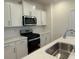 Well-equipped kitchen featuring stainless steel appliances, white cabinets, and bright countertops at 1033 Jase Dr., Longs, SC 29568