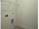 Bright laundry area features convenient shelving and hookups for washer and dryer at 1033 Jase Dr., Longs, SC 29568