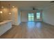 Bright open-concept space with kitchen island and living area, featuring sleek floors and a modern ceiling fan at 1033 Jase Dr., Longs, SC 29568
