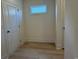 Practical mudroom with wood-look floors, a window and convenient access to the garage and other areas at 1033 Jase Dr., Longs, SC 29568