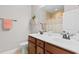 Bathroom features double sinks, cherry wood cabinets, and a shower with a curtain at 1035 Brentford Pl., Myrtle Beach, SC 29579