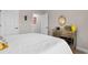 Cozy bedroom features a large bed with a white quilt, a dresser, and a neutral color palette at 1035 Brentford Pl., Myrtle Beach, SC 29579