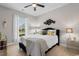Comfortable bedroom with large window, decorative pillows, and a black and white accent blanket at 1035 Brentford Pl., Myrtle Beach, SC 29579