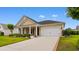 Inviting single-Gathering home showcasing a well-maintained lawn, complemented by a spacious two-car garage at 1035 Brentford Pl., Myrtle Beach, SC 29579