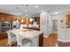 Modern kitchen featuring a large island with granite countertops, stainless steel appliances, and ample cabinet space at 1035 Brentford Pl., Myrtle Beach, SC 29579