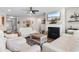 A bright living room features a fireplace with TV, comfortable seating, and elegant decor at 1035 Brentford Pl., Myrtle Beach, SC 29579