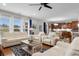Bright living room showcasing ample seating, large windows and an archway leading to the kitchen at 1035 Brentford Pl., Myrtle Beach, SC 29579