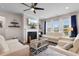 Cozy living room features a fireplace with TV, comfortable seating, and elegant decor at 1035 Brentford Pl., Myrtle Beach, SC 29579