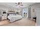 Spacious main bedroom featuring a tray ceiling, comfortable bed, and natural light at 1035 Brentford Pl., Myrtle Beach, SC 29579