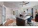 Bright home office boasts hardwood floors, ceiling fan, French doors, and a large work space at 1035 Brentford Pl., Myrtle Beach, SC 29579