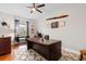 Bright home office featuring a large desk, decorative items, and neutral wall color at 1035 Brentford Pl., Myrtle Beach, SC 29579
