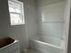 Bathroom featuring a new tub with a tile surround and vanity at 1037 Jase Dr., Longs, SC 29568
