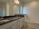 Bathroom featuring a large mirror, double sinks, vanity, and a soaking tub at 1037 Jase Dr., Longs, SC 29568