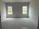 Spacious bedroom featuring two windows allowing for ample natural light at 1037 Jase Dr., Longs, SC 29568