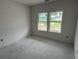 Spacious bedroom featuring two windows allowing for ample natural light at 1037 Jase Dr., Longs, SC 29568