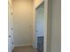 Hallway with wood-look flooring leading to a carpeted room through an open doorway at 1037 Jase Dr., Longs, SC 29568
