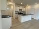 Modern kitchen with white cabinets, granite countertops, and stainless steel appliances at 1037 Jase Dr., Longs, SC 29568