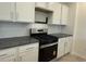 The kitchen is complete with stainless steel appliances, white cabinets, and granite countertops at 1037 Jase Dr., Longs, SC 29568