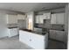 Unfinished kitchen featuring white cabinets, an island, and space for modern appliances and countertops at 1037 Jase Dr., Longs, SC 29568