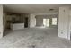Spacious living area with a kitchen and island, sliding glass doors, and a large open floor plan at 1037 Jase Dr., Longs, SC 29568