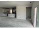 Open-concept living room with kitchen and modern cabinets at 1037 Jase Dr., Longs, SC 29568